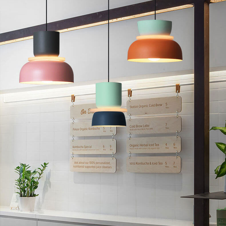 Modern dual-tone Nordic dome pendant light installed in a contemporary dining room. Ceiling lamp.