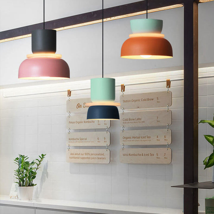 Modern dual-tone Nordic dome pendant light installed in a contemporary dining room. Ceiling lamp.