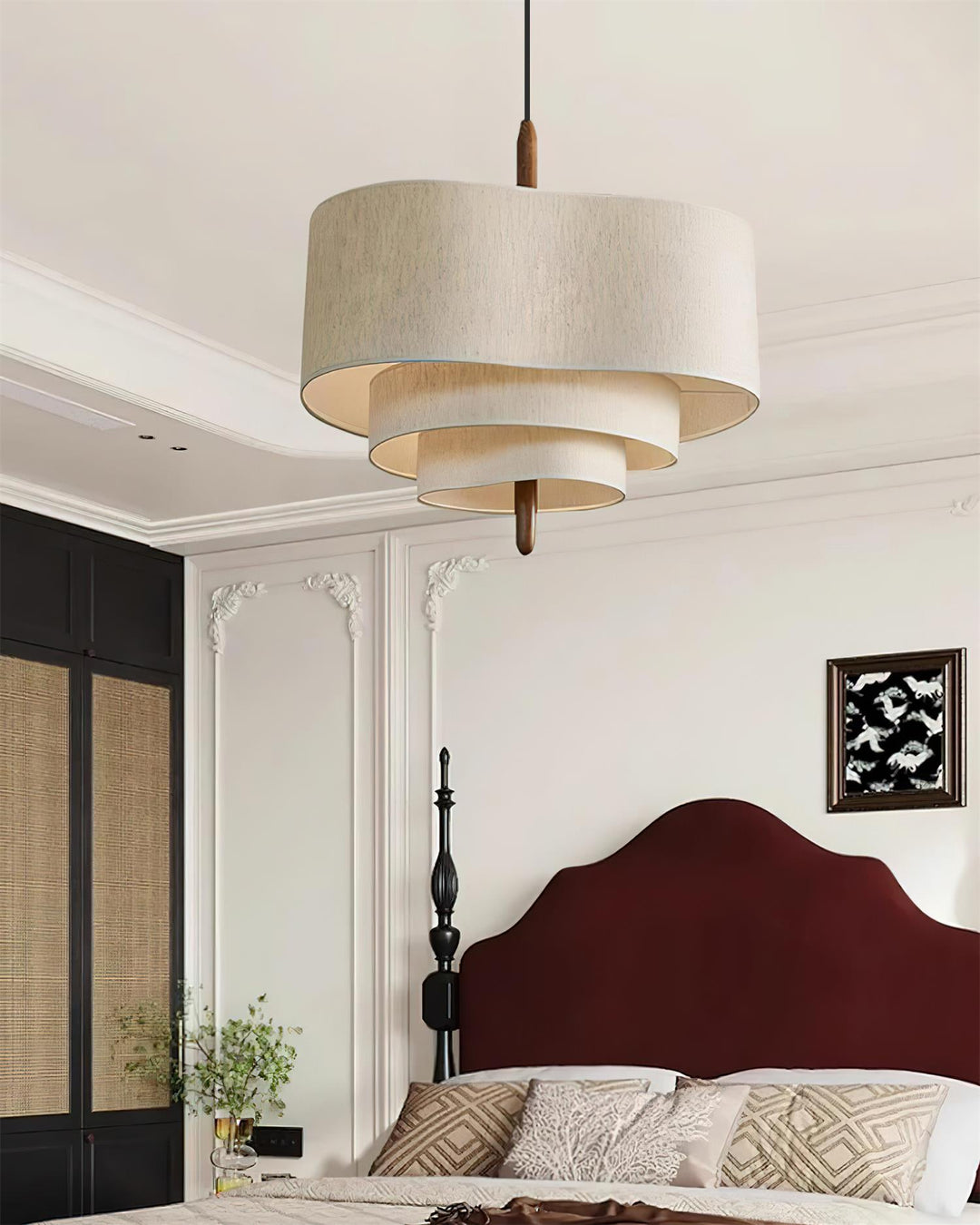 Adjustable fabric pendant lamp with wood detail, ideal for modern bedroom decor.