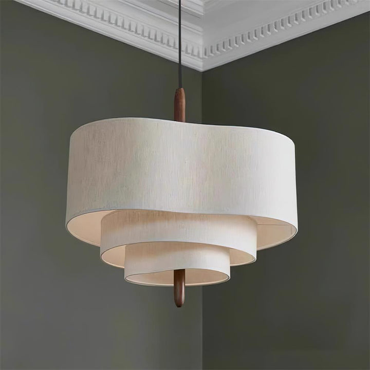 Fabric and wood pendant light for a sleek, modern kitchen island design.