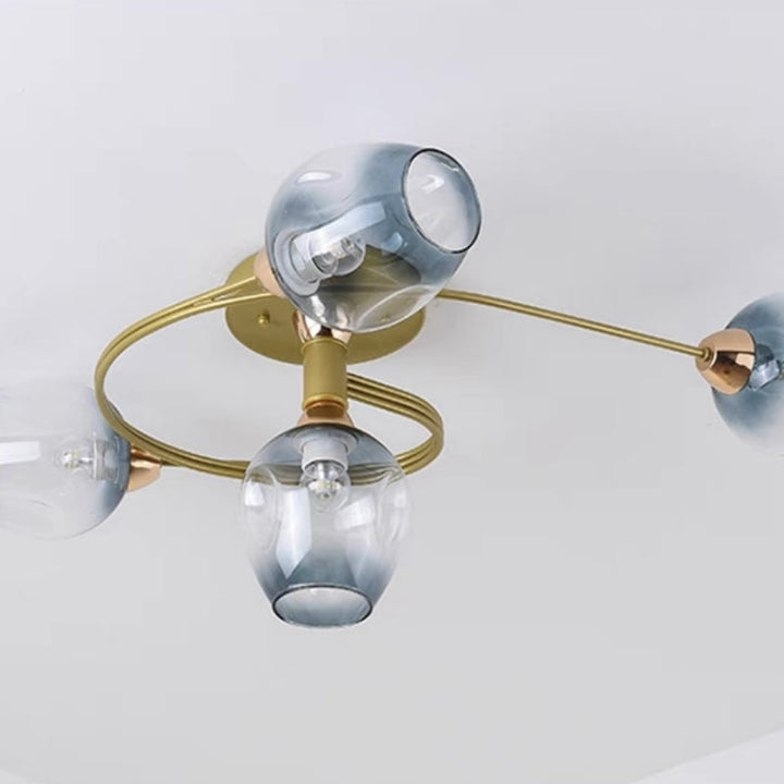 Ambient gold flush mount ceiling light, adds warmth to any dining space.