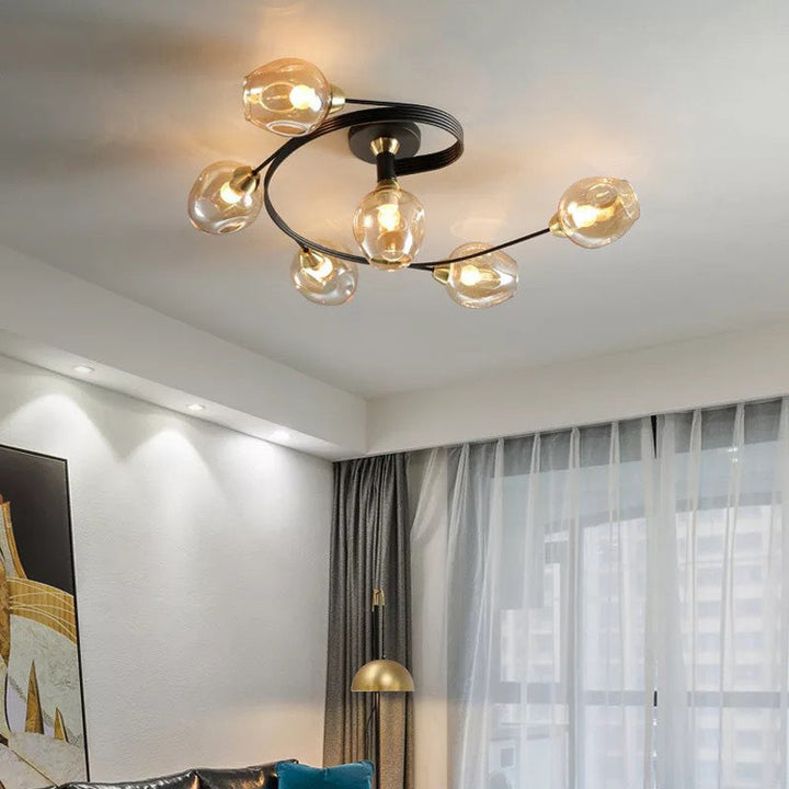 Elegant gold flush mount fixture, brightens modern dining room spaces.