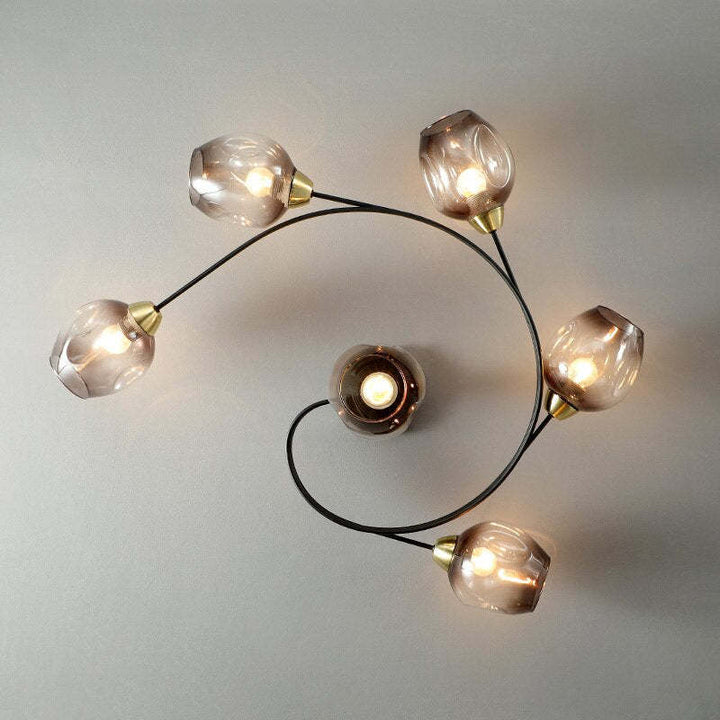 Ambient black flush mount ceiling light, creates a cozy living room glow.