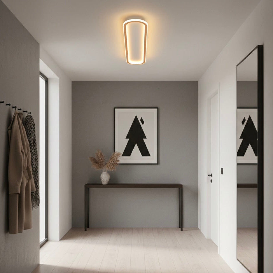 Sleek geometric LED ceiling lamp, hardwired for modern home decor, ideal bedroom lighting.