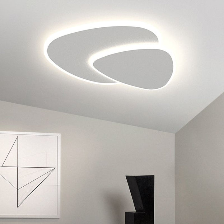 Geometric LED triangle flush mount light, a modern, energy-efficient ceiling fixture for homes.