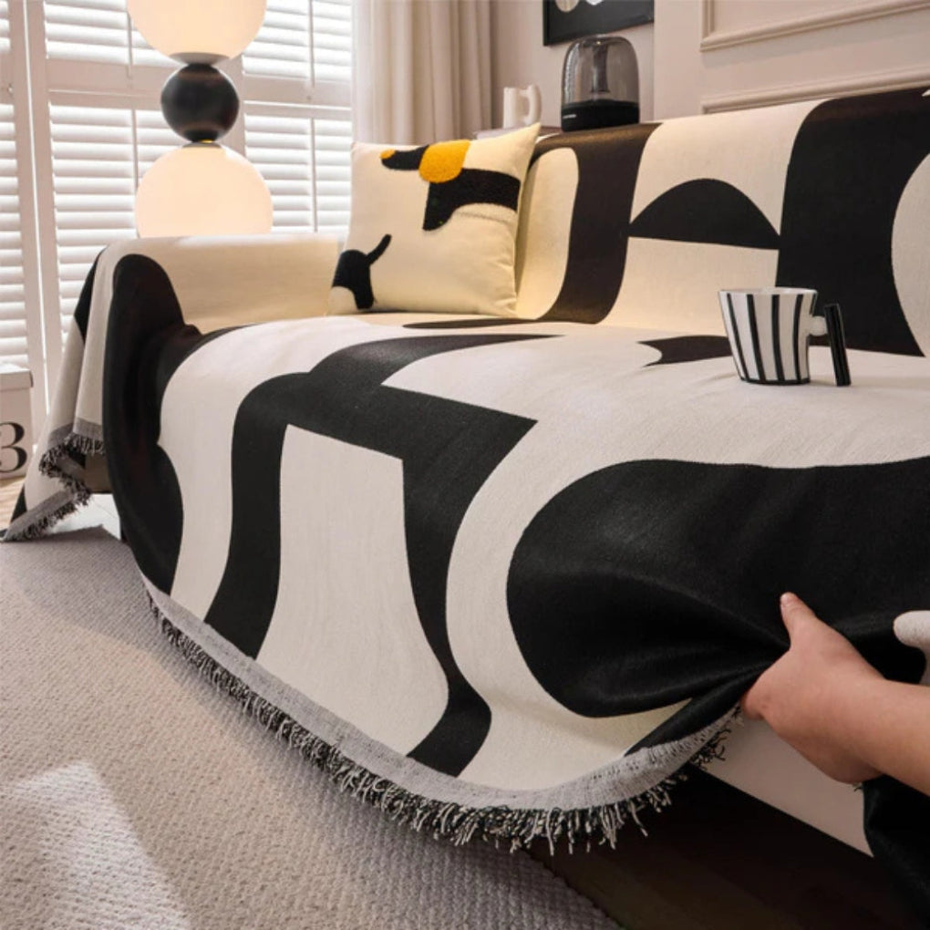 Abstract geometric sofa throw, transforming living room furniture with a fresh, modern home decor accent.