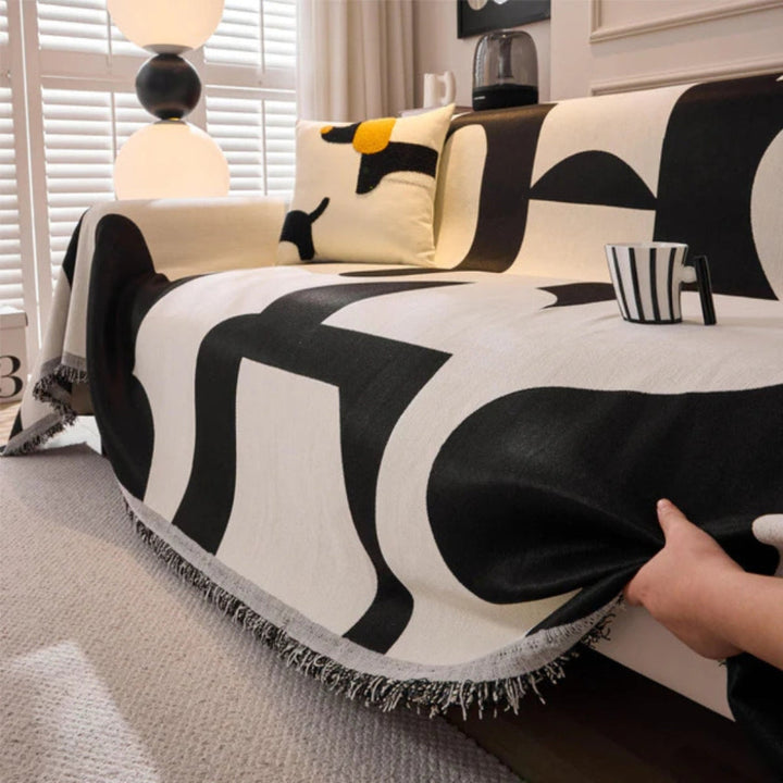 Abstract geometric sofa throw, transforming living room furniture with a fresh, modern home decor accent.