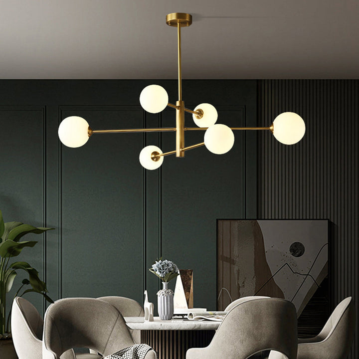 Elegant gold globe chandelier, a multi-light ceiling fixture for luxurious living room or entryway.