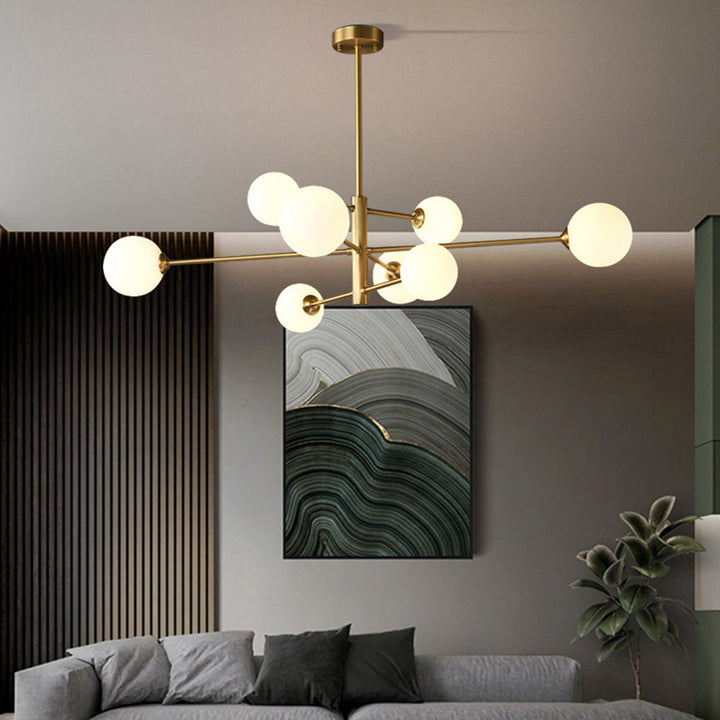 Sleek gold globe chandelier, a stylish multi-light pendant for modern living room ceiling decor.