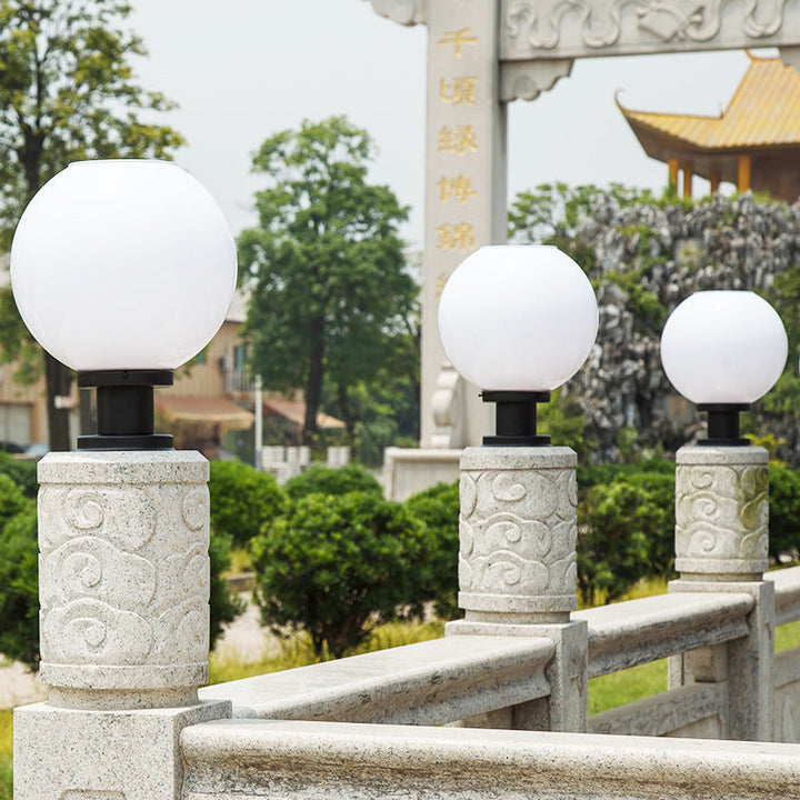 Sleek LED modern globe outdoor fence post light. Perfect for illuminating garden paths & landscape. Durable design.