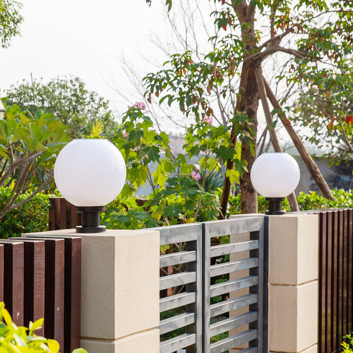 Contemporary globe post cap light for outdoor fence posts. Weather-resistant exterior garden & pathway illumination.