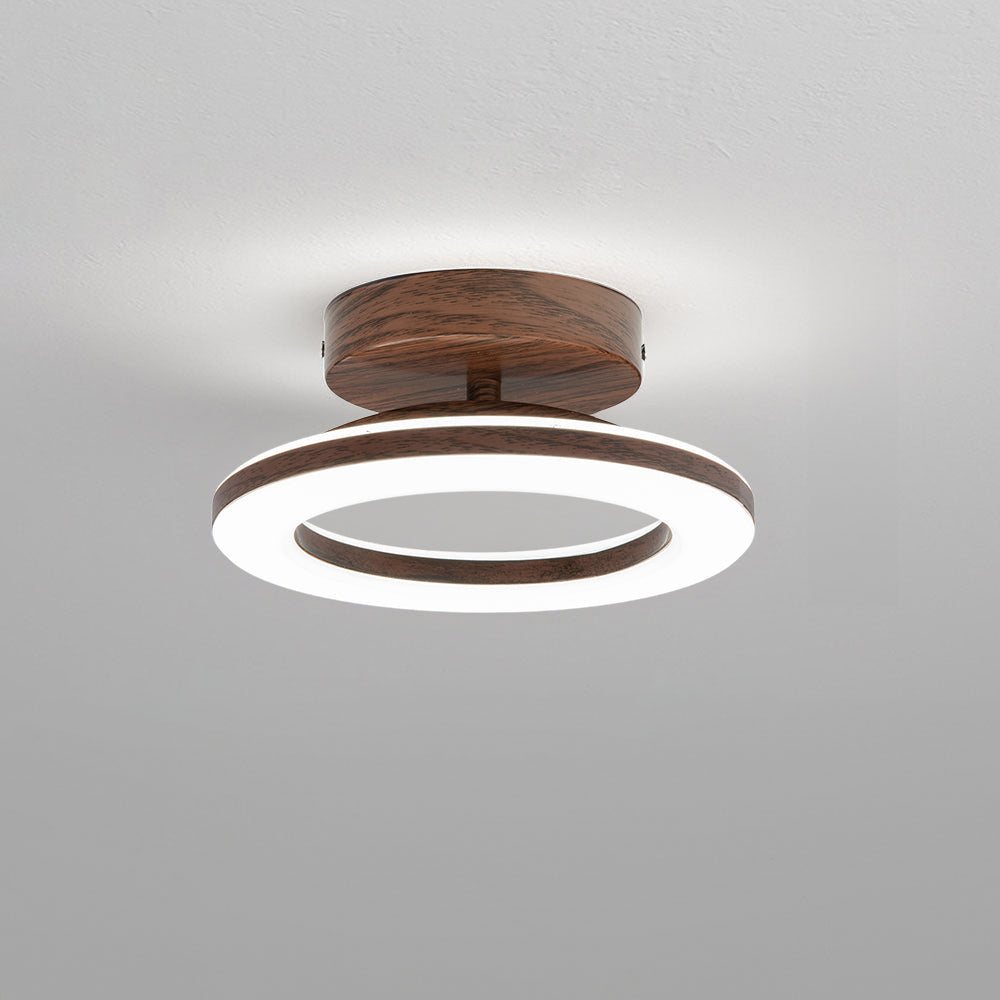 Elegant LED disc ceiling light, modern home decor, provides soft ambient glow.