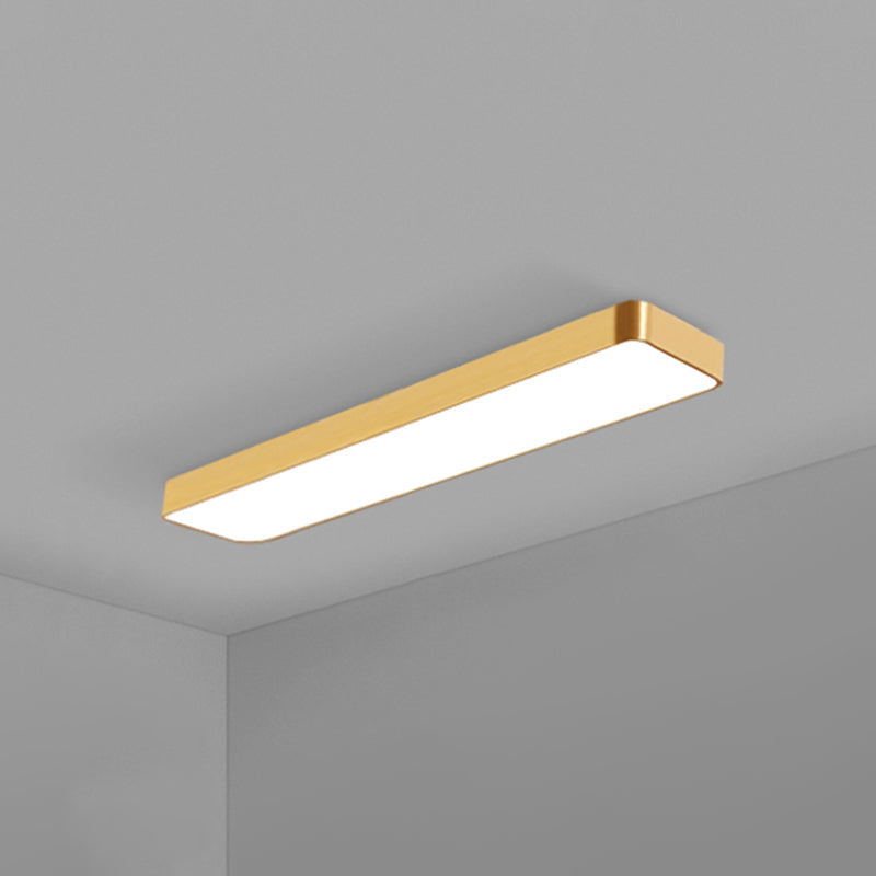 Elegant gold finish rectangular LED ceiling light, a modern flush mount for refined interiors.