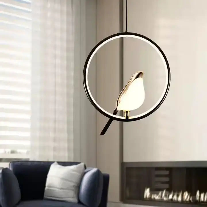Golden bird LED pendant light illuminating a modern living space, an elegant designer ceiling lamp fixture.