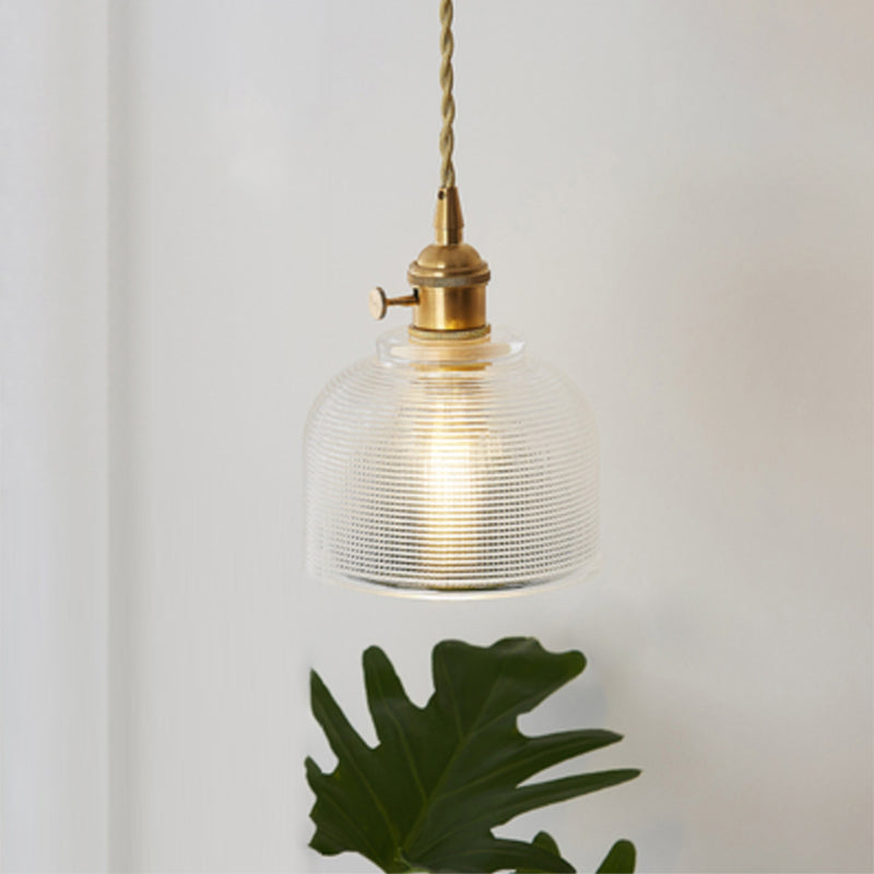 Sleek modern industrial clear glass pendant light fixture, ideal for contemporary spaces.