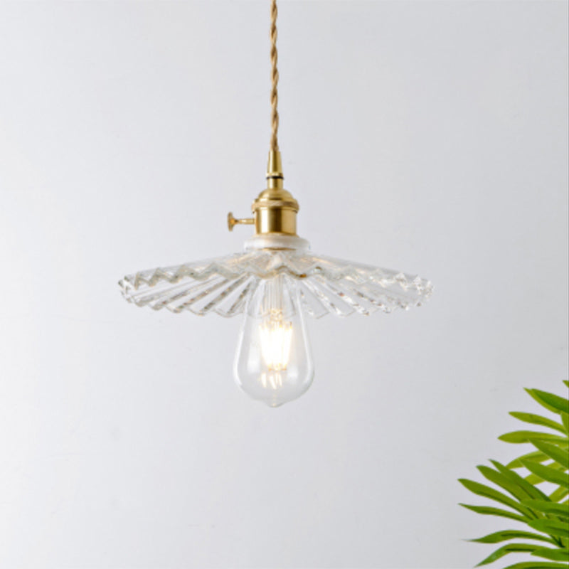 Crystal clear glass modern industrial pendant light, brightens dining and kitchen areas.