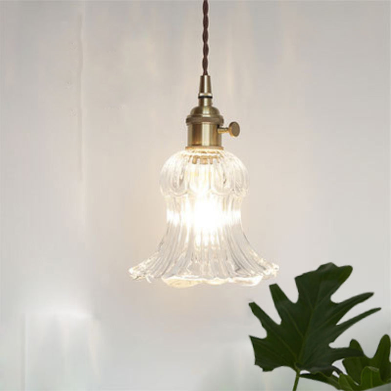 Simple yet elegant modern industrial clear glass pendant light for kitchen islands.