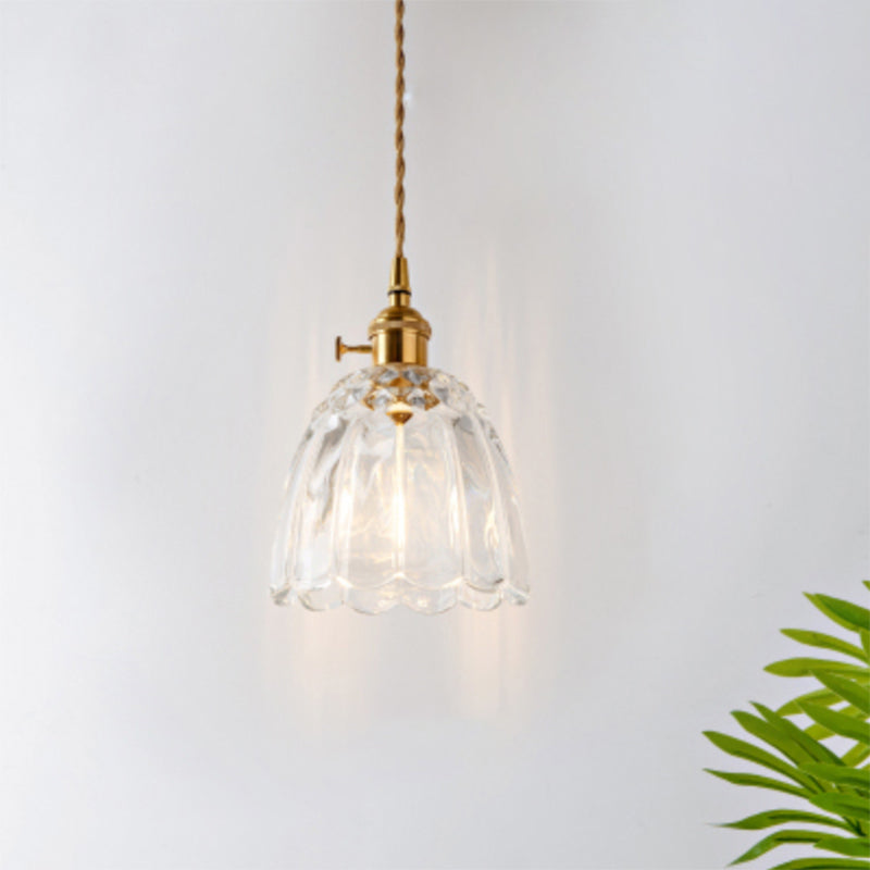 Clear glass and matte black industrial pendant light, modern ceiling lamp design.