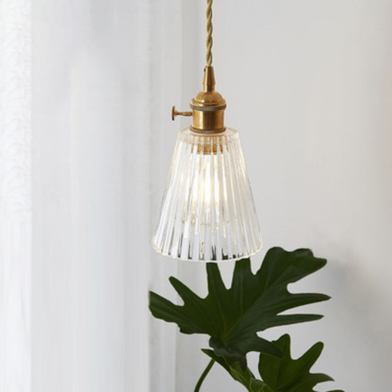 Stylish modern industrial clear glass pendant light, enhances any room's decor.