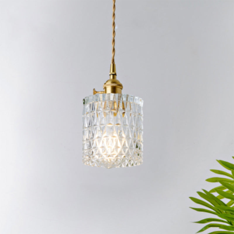 Minimalist modern industrial clear glass pendant light, elegant hanging lamp.
