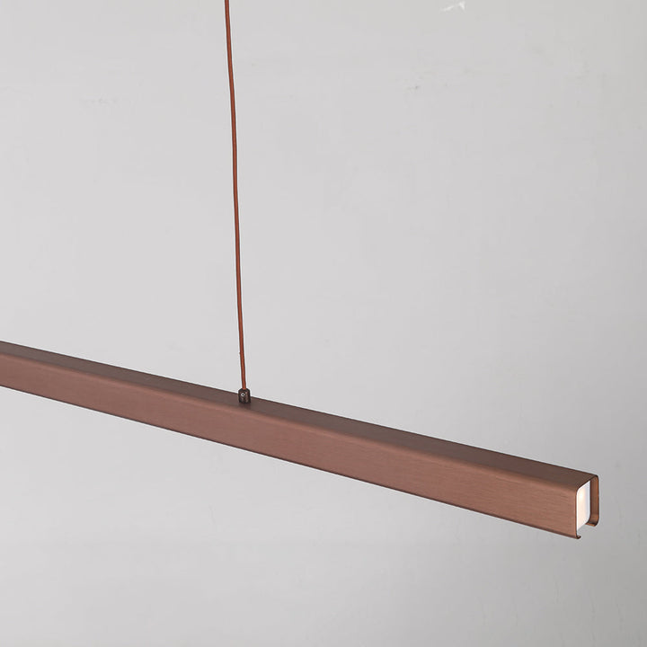 Modern linear lamp for dining rooms, a sleek adjustable LED fixture.