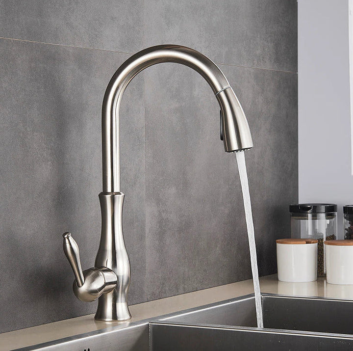Brushed nickel kitchen sink mixer with pull-out spray, a stylish and durable upgrade for any modern kitchen.