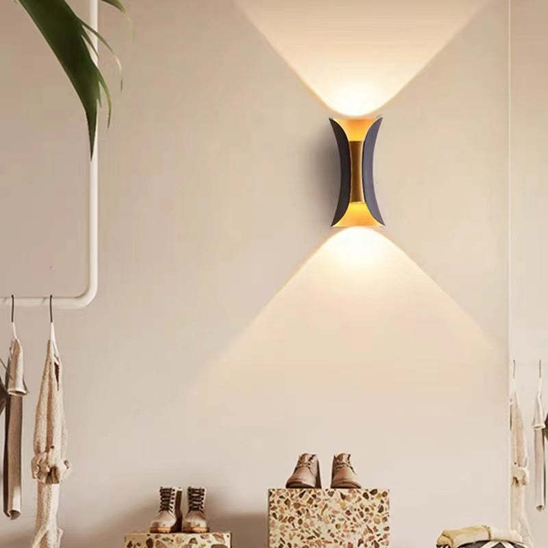 Contemporary metal LED outdoor fixture, enhancing garden and patio ambiance.