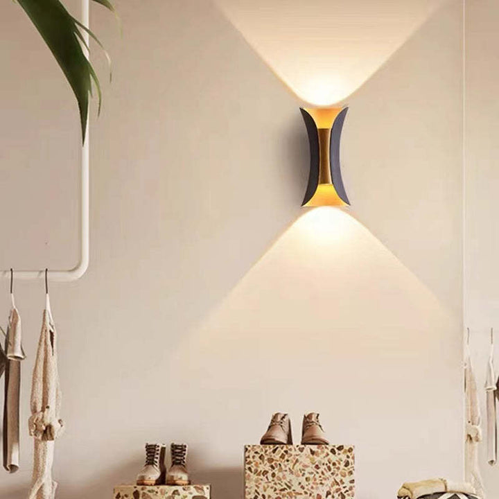 Contemporary metal LED outdoor fixture, enhancing garden and patio ambiance.