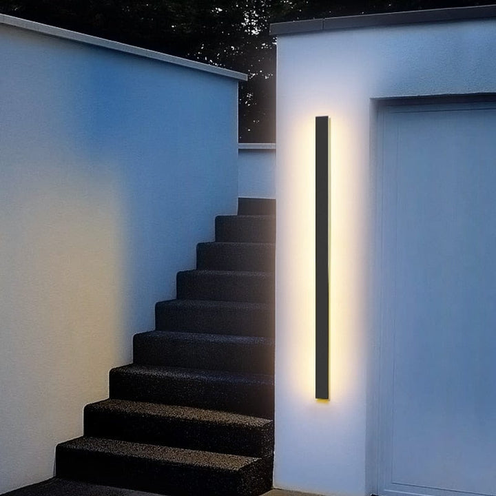 Durable LED porch sconce, modern backlit style, suitable for all weather conditions.