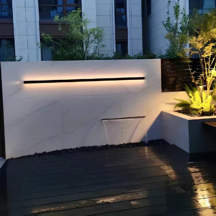 Contemporary exterior LED wall light, energy-saving, enhances any modern home facade.