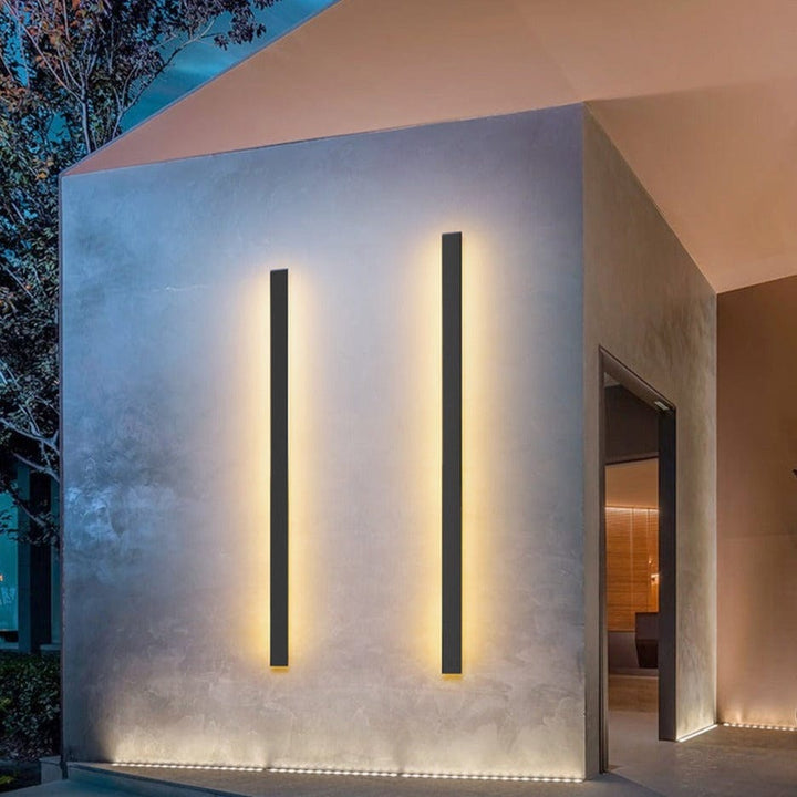 Backlit LED wall sconce, weatherproof, offers stylish and efficient outdoor lighting solution.