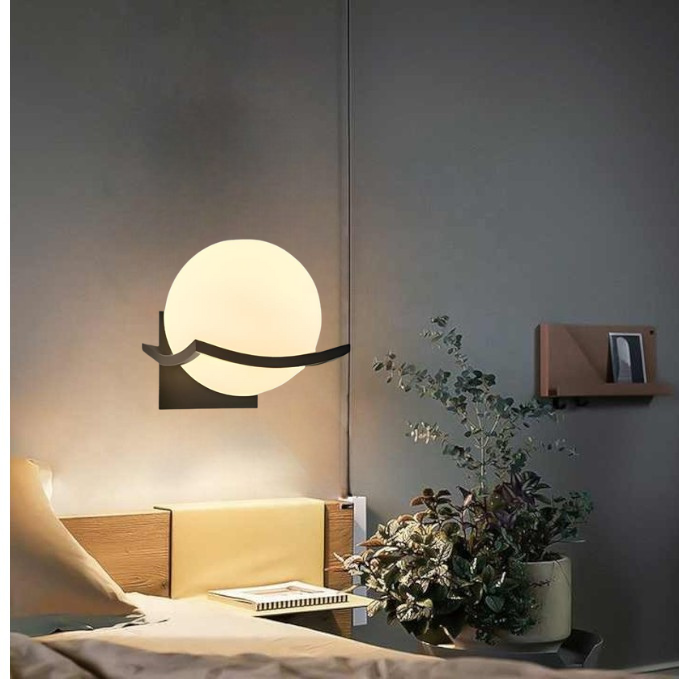 Modern LED wall lamp with sleek glass finish, ideal for contemporary home decor and energy-efficient lighting.