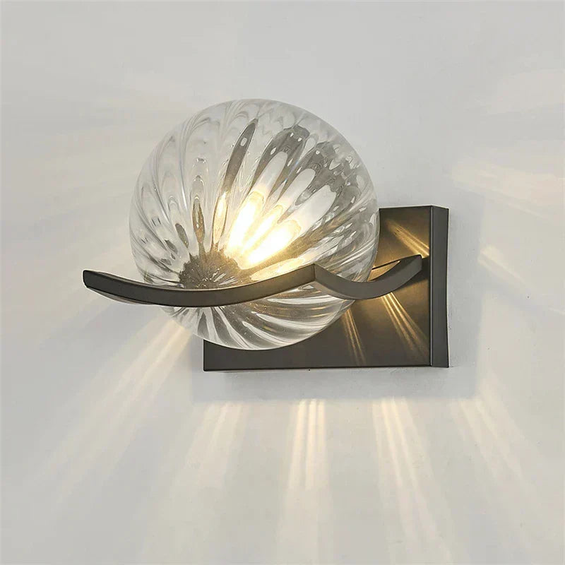 Modern LED wall lamp with sleek glass finish, ideal for contemporary home decor and energy-efficient lighting.