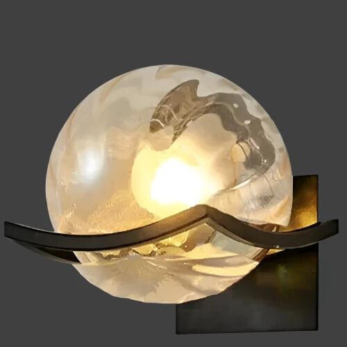 Modern LED wall lamp with sleek glass finish, ideal for contemporary home decor and energy-efficient lighting.