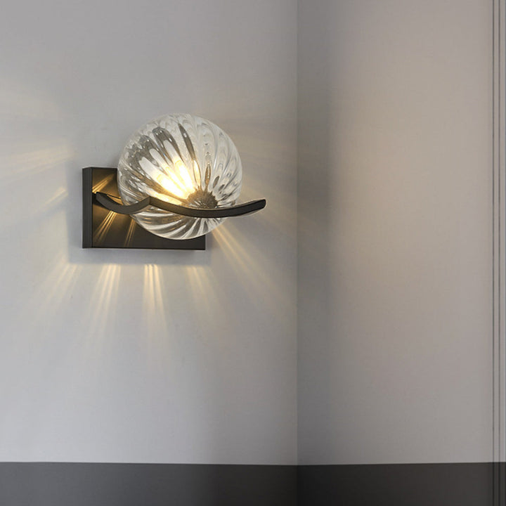 Modern LED wall lamp with sleek glass finish, ideal for contemporary home decor and energy-efficient lighting.