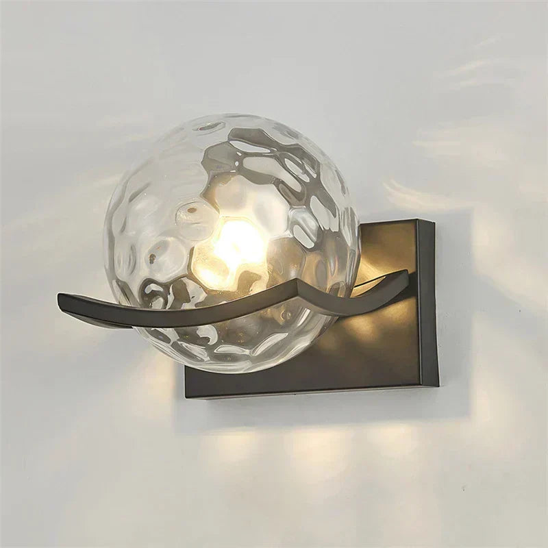 Modern LED wall lamp with sleek glass finish, ideal for contemporary home decor and energy-efficient lighting.
