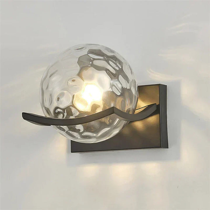 Modern LED wall lamp with sleek glass finish, ideal for contemporary home decor and energy-efficient lighting.