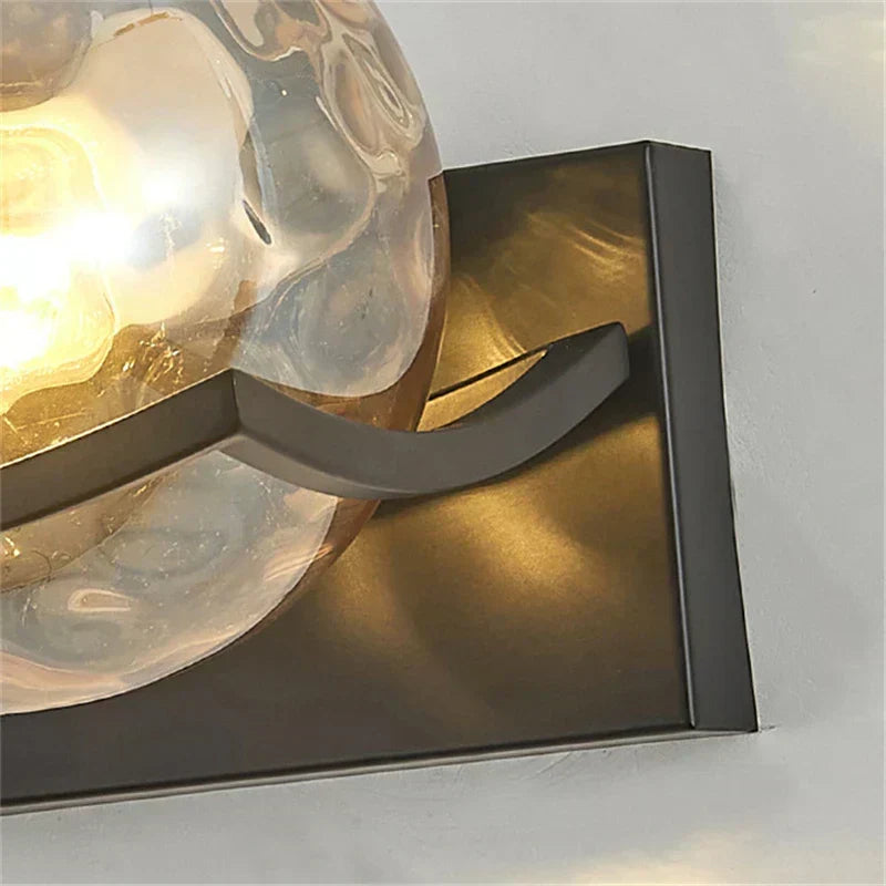 Modern LED wall lamp with sleek glass finish, ideal for contemporary home decor and energy-efficient lighting.
