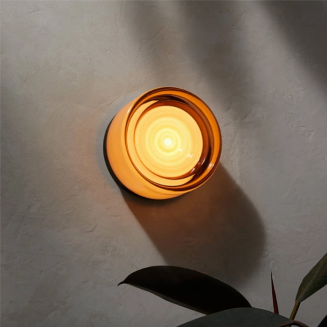 Custom color modern LED wall sconce, a decorative hardwired lighting solution for homes.
