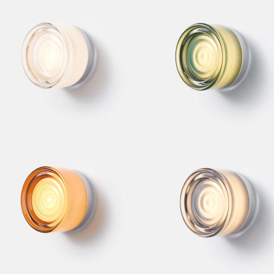 Modern LED wall sconce, customizable glass & base. Ideal for indoor ambient & decorative lighting.