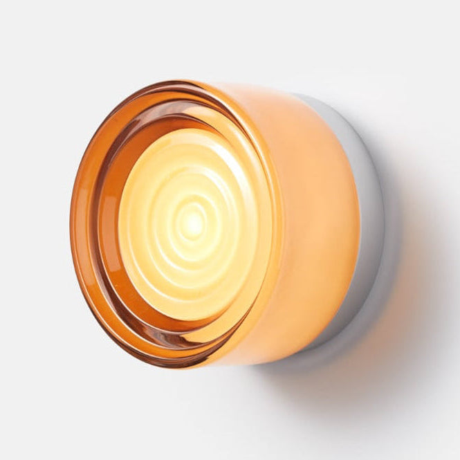 Customizable modern LED wall sconce with colored glass & base options for personalized decor.