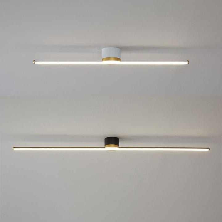 Contemporary linear LED flush mount ceiling light. Minimalist metal fixture enhances modern home lighting.
