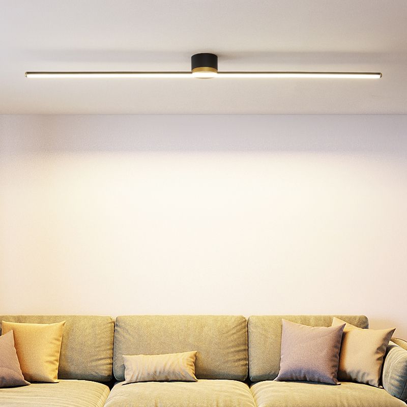 Modern linear LED flush mount ceiling light in a minimalist living room setting. Bright indoor fixture.