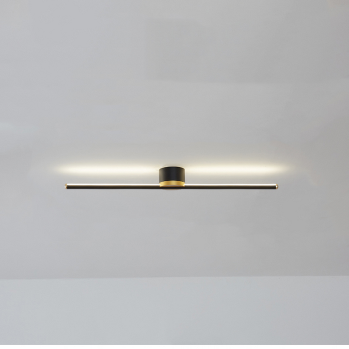 Detail of the sleek metal finish on a modern linear LED flush mount ceiling light fixture.