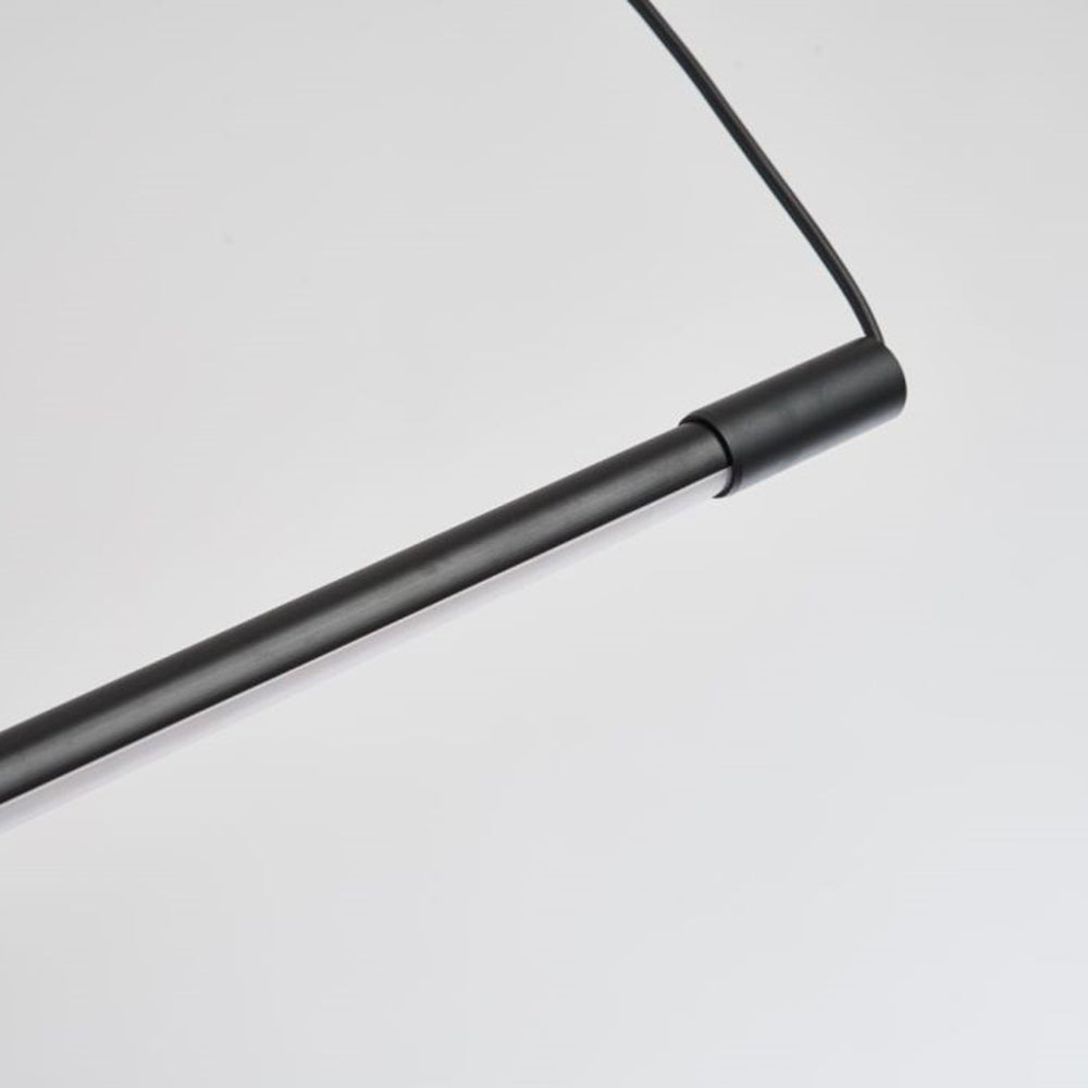 Modern adjustable linear LED pendant light with a sleek acrylic diffuser, enhancing minimalist home decor.