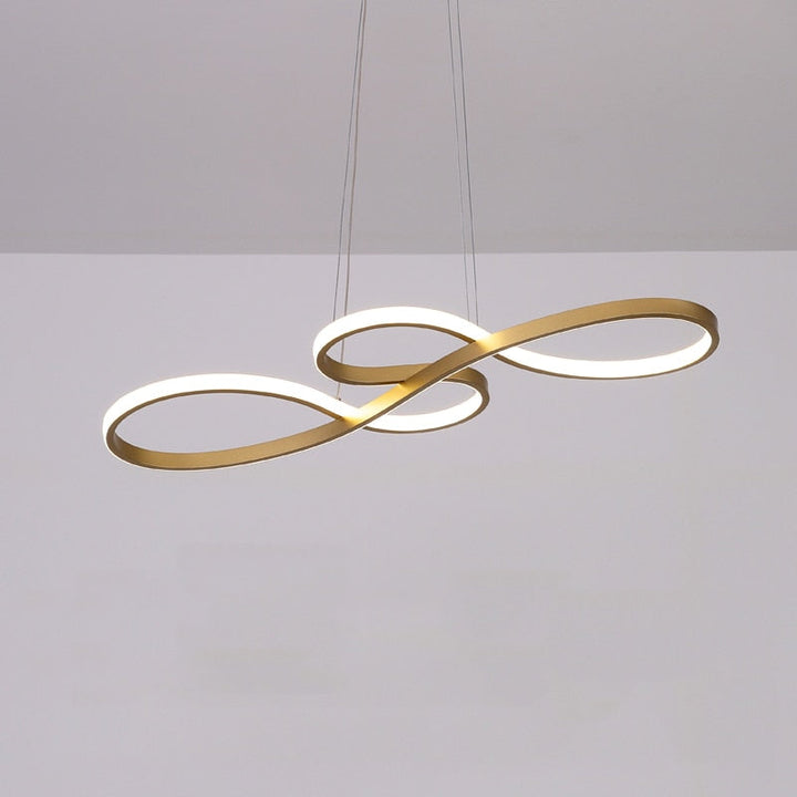 Contemporary linear pendant light above dining table. Modern LED ceiling fixture, black finish.