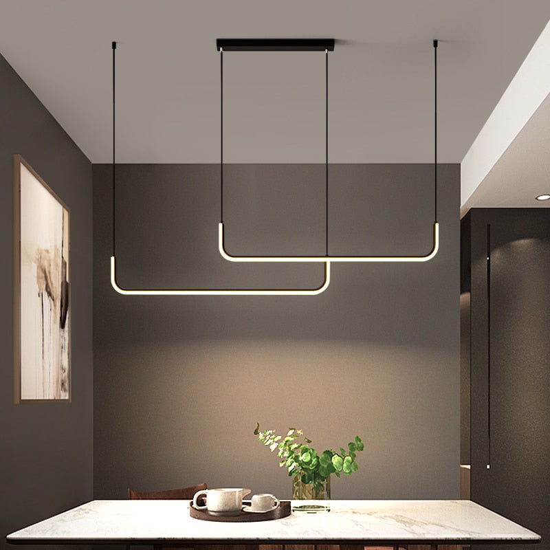 Energy-efficient linear LED pendant, a stylish modern choice for dining room or kitchen lighting.