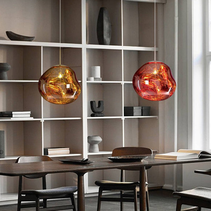 Abstract Melt pendant lamp, a mesmerizing ceiling fixture with a reflective, molten look.