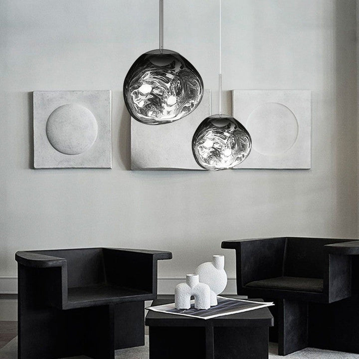 Sculptural Melt pendant light, an elegant organic fixture enhancing dining room decor.
