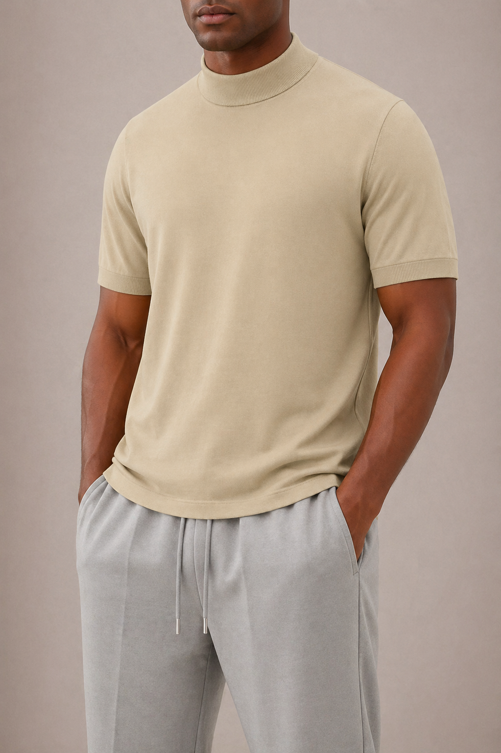 Man in motion, stylishly wearing a modern fit men's short sleeve turtleneck t-shirt. Versatile casual fashion.